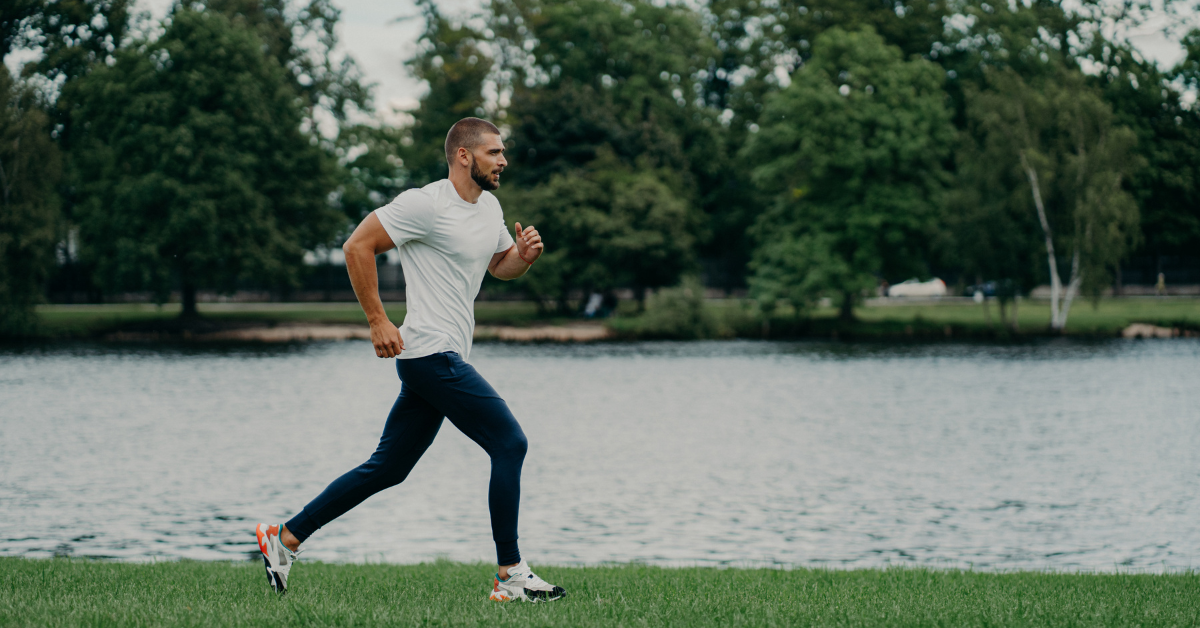 Photo of a man running along the water, promoting physical therapy for your first choice in rehab for runners from Mishock PT.